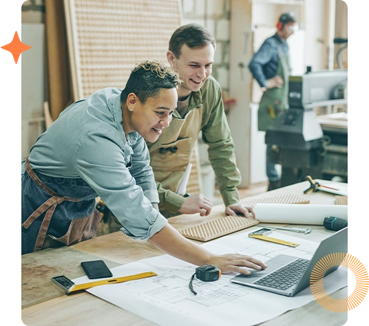 Business owners looking at blueprints