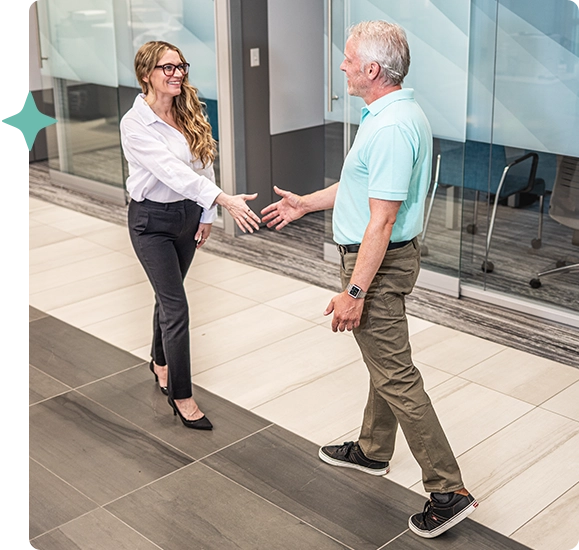 Financial coach meeting member in branch lobby