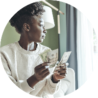 A woman counting her cash