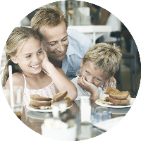 A father getting lunch with his kids