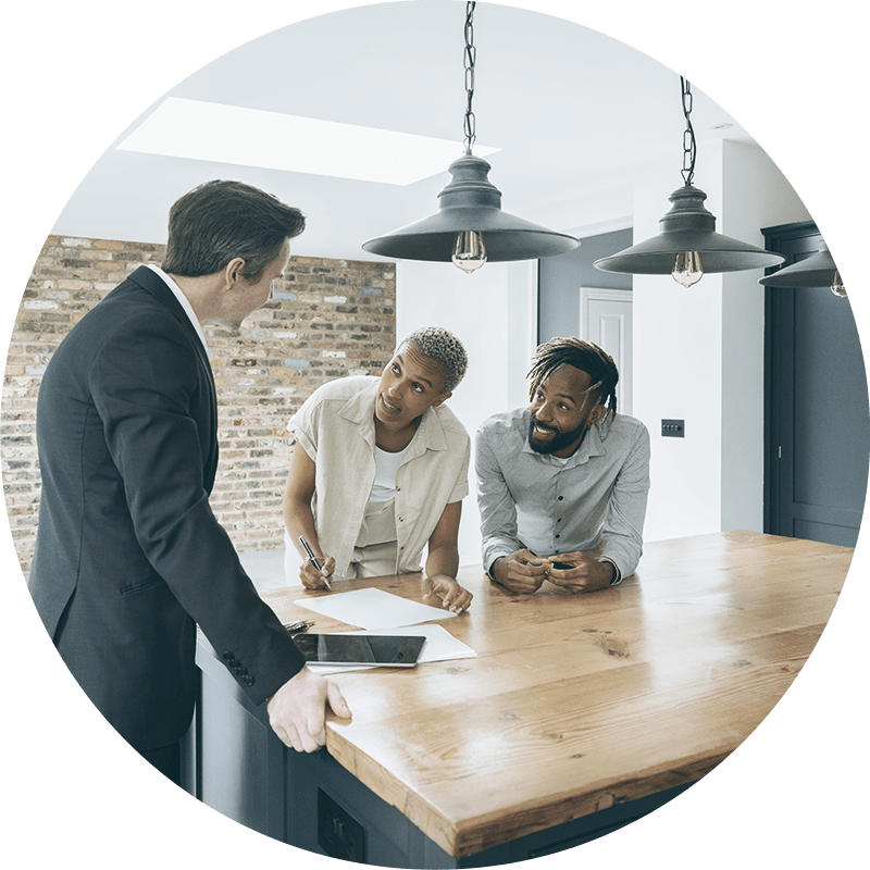 A couple looking at blueprints for a new house