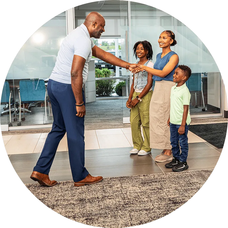 A financial coach welcoming mambers
