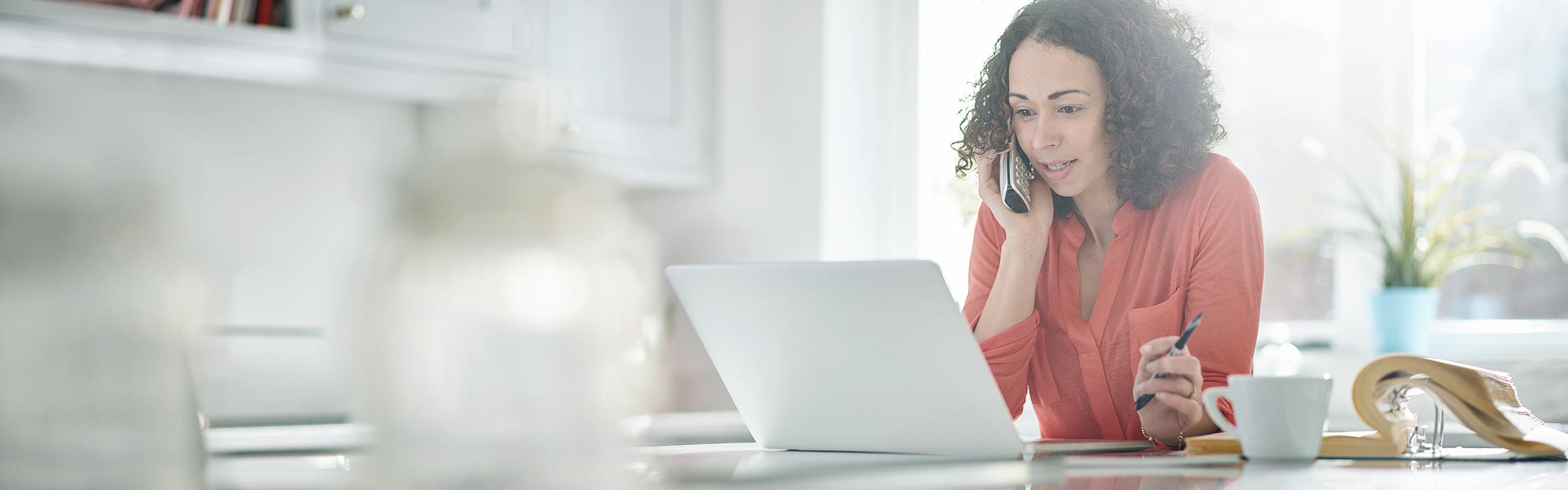 A woman on the phone with a lending representative