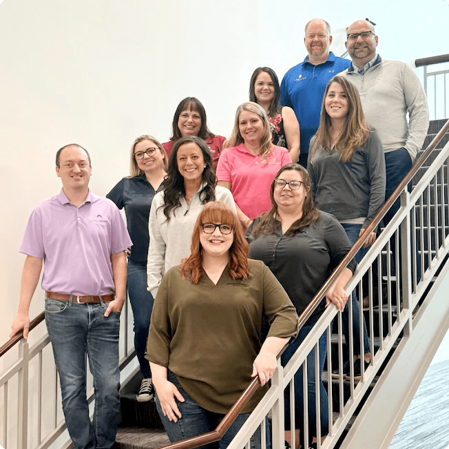 Vantage Mortgage Solutions team standing on stairs