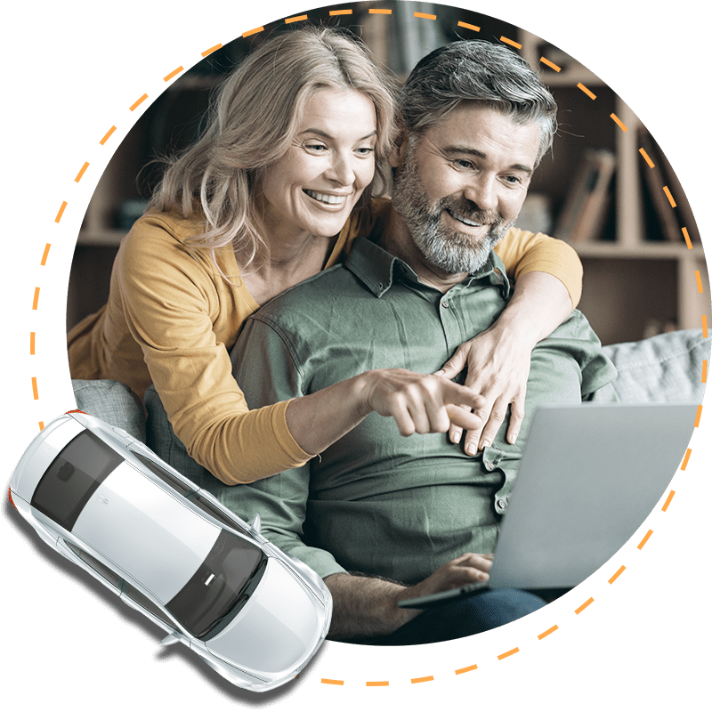 A couple financing a vehicle on a laptop