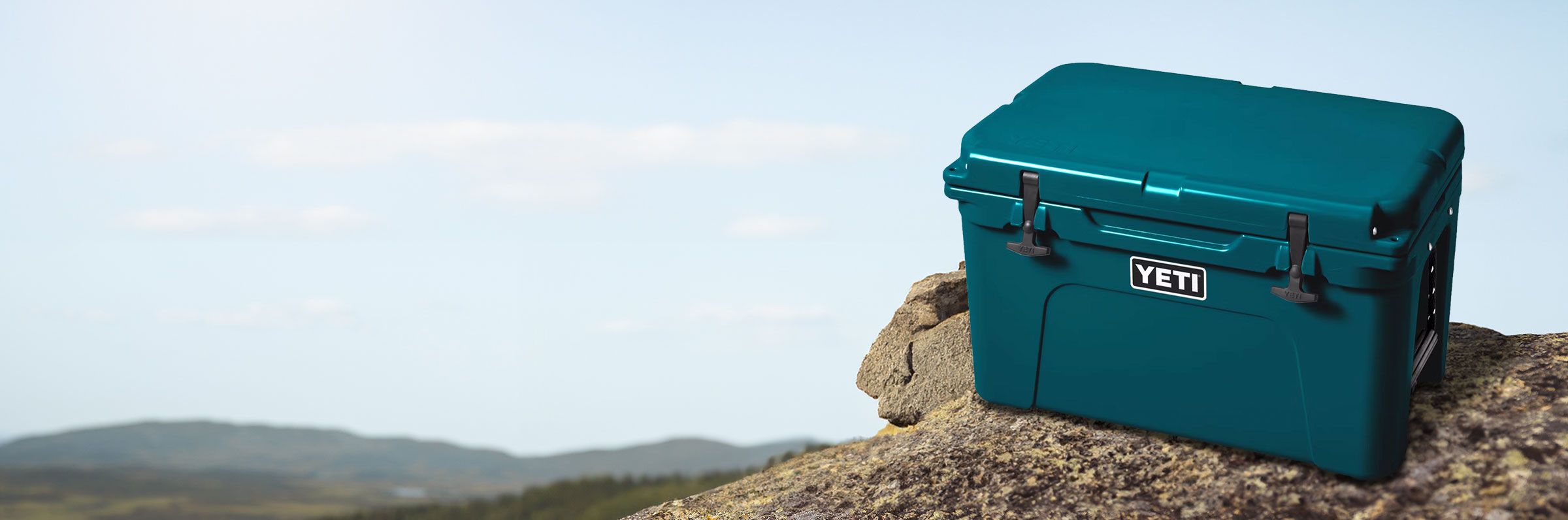 Yeti cooler sitting at the top of a mountain
